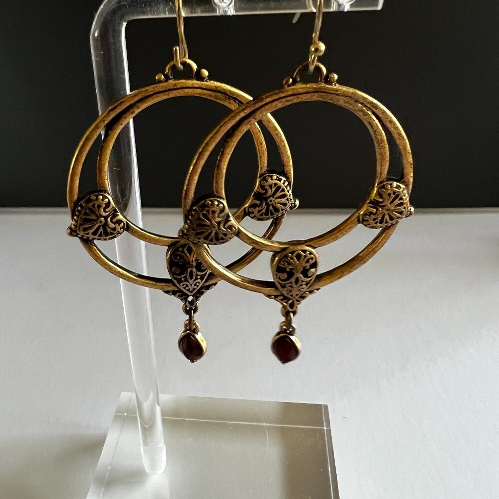 Ornate brass drop earrings with red stone